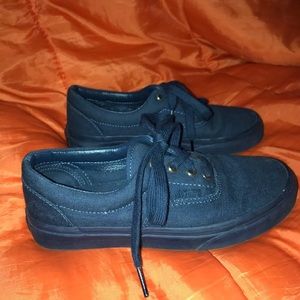 Navy blue vans with gold shoe lace holes